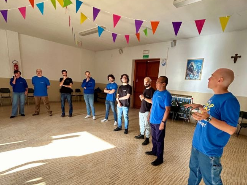 The Nephila team standing in a circle during an improv exercise led by Alfredo Morresi.