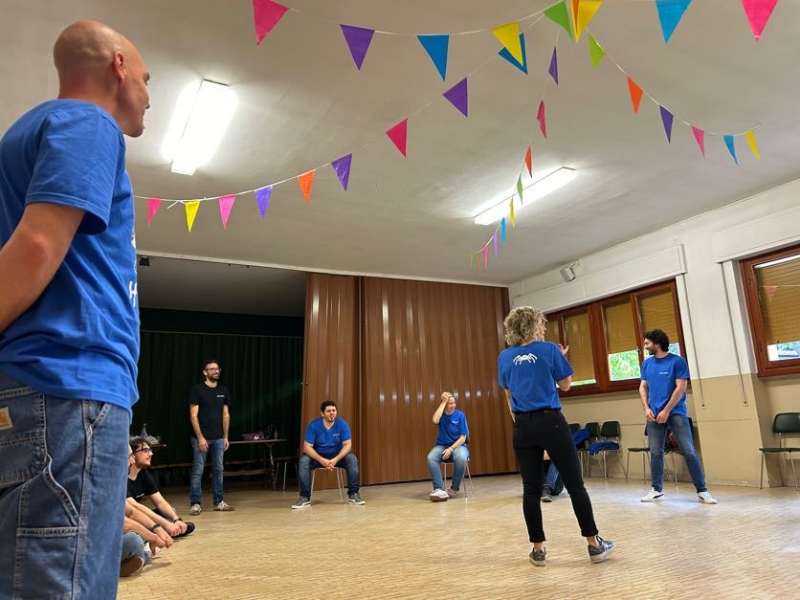 Nephila team in a circle during an applied improv exercise.