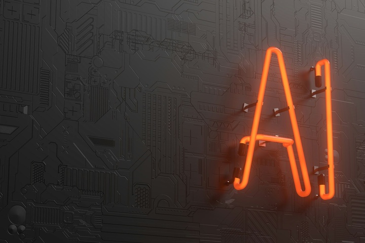 Insegna al neon arancione con la scritta "AI" su una parete scura decorata come un circuito stampato.
